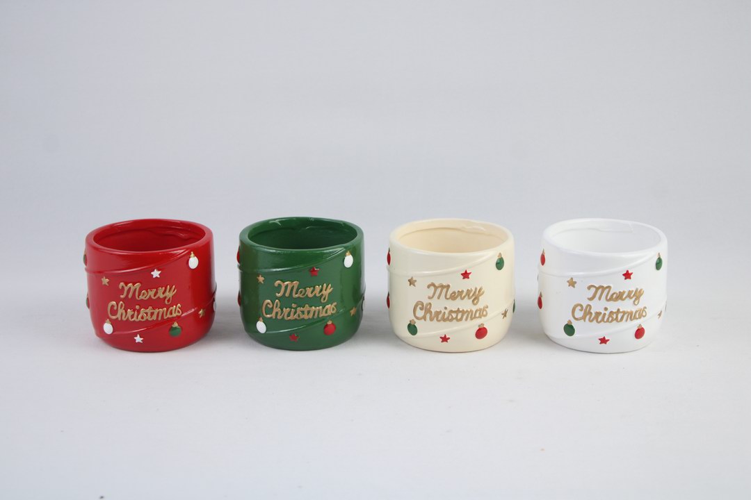 Four color variations of Christmas ceramic planters with decorative lettering and seasonal motifs.