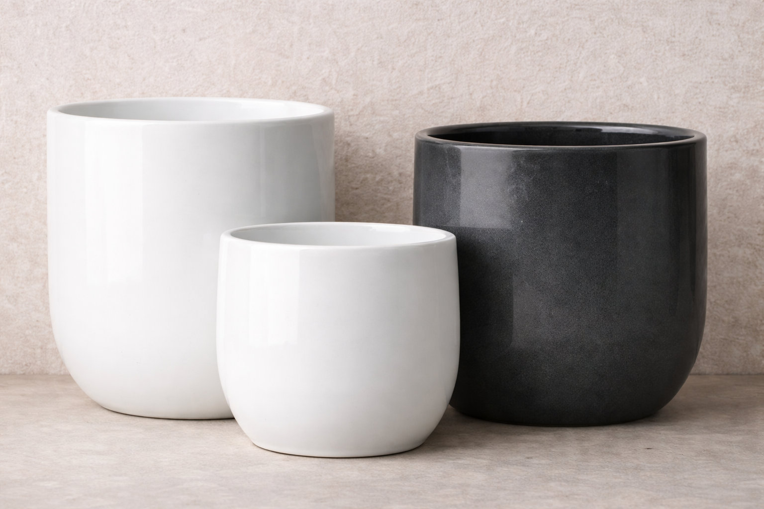 Gloss-glazed ceramic planter showing reflected light and depth of color on its surface
