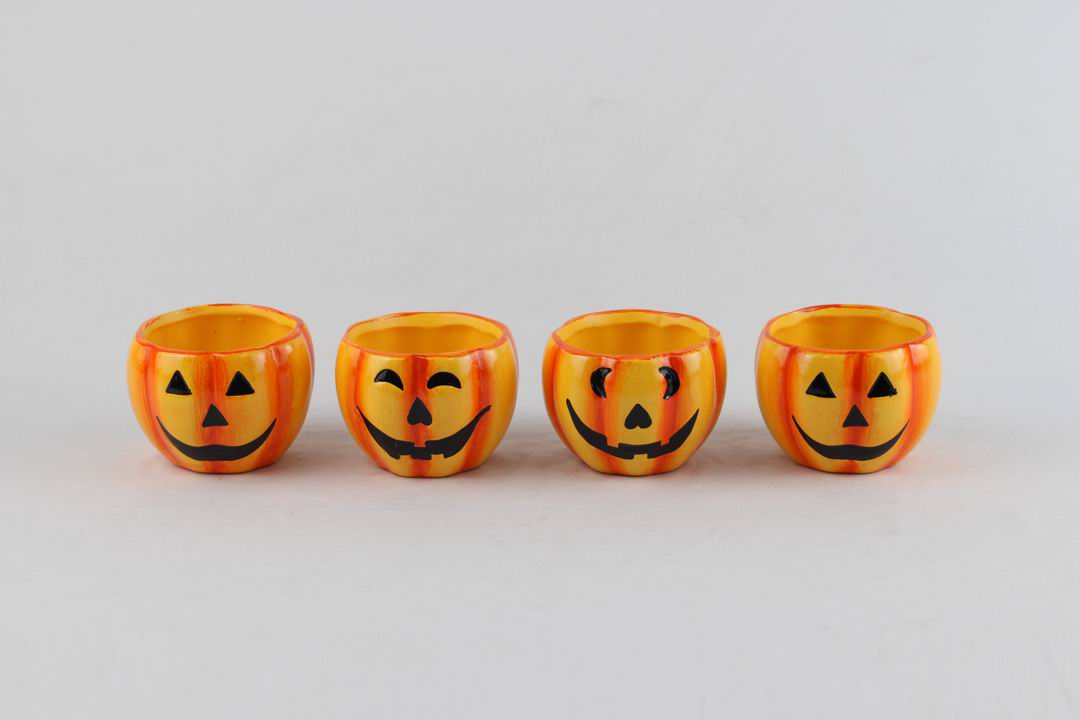 Halloween planter assortment featuring themed shapes and seasonal decorative graphics